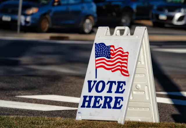 A 'Vote Here' sign outside a polling place at Woodbury City Hall in Woodbury, Minnesota